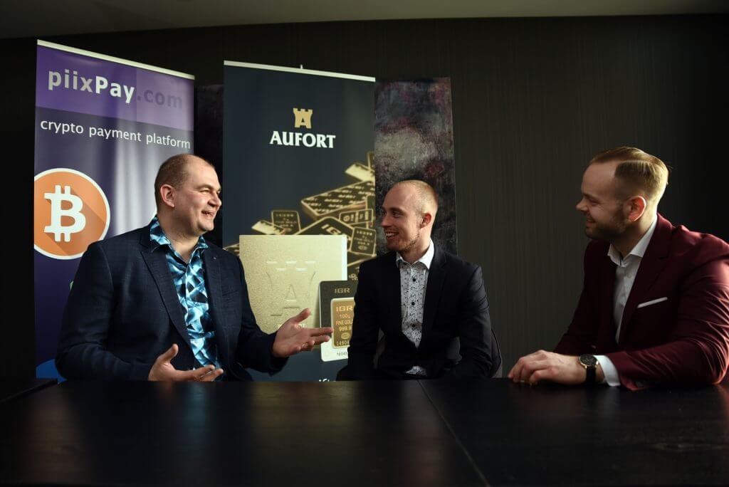 Three men having a discussion at a table