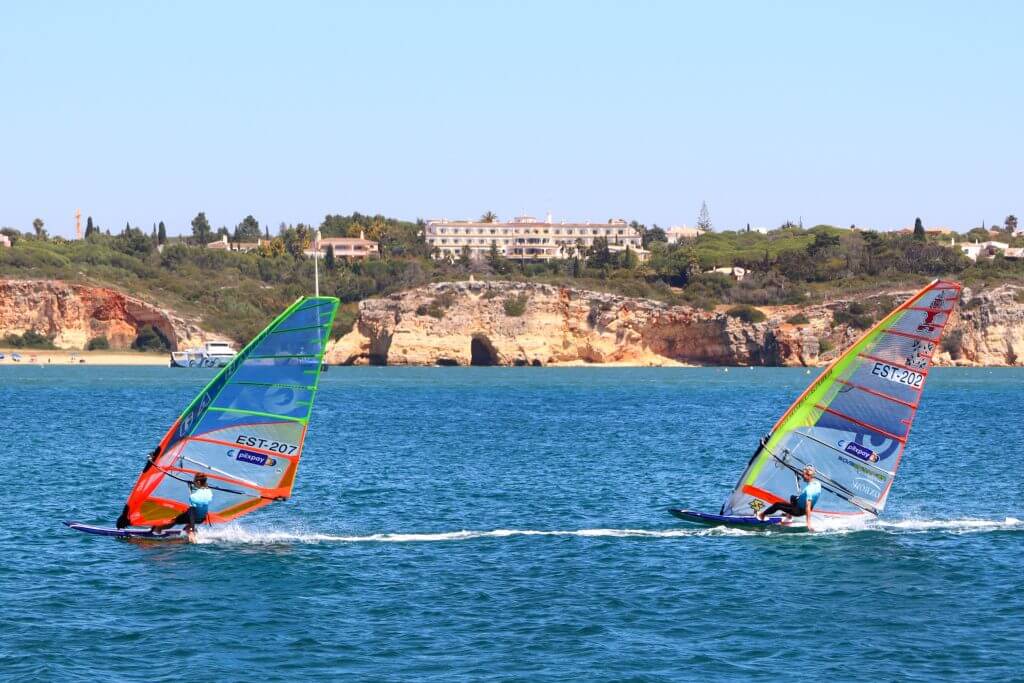 Men wind surfing together