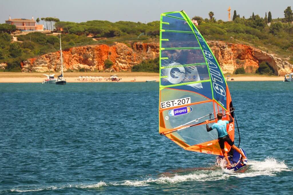 A man wind surfing during a sunny day